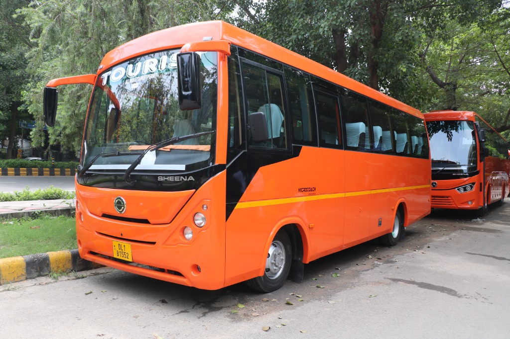 Signature Neon Orange Luxury Tourist Microcoach Sheena 21-27 Seater AC Bus Rental Delhi - Ajay Travels